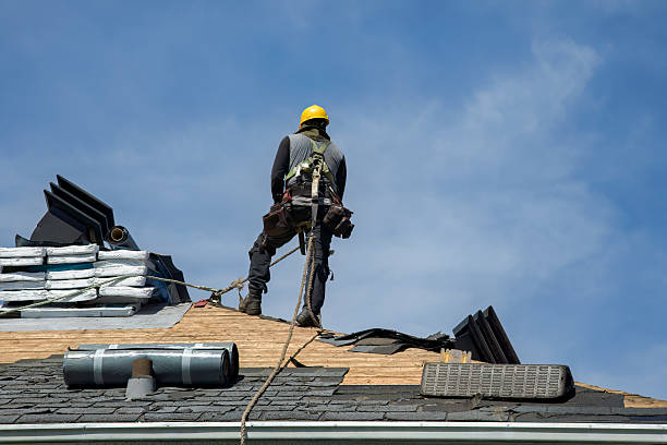 Professional Roof Replacement technician working in Howard Beach, NY